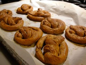 Pretzels baked on parchment paper.