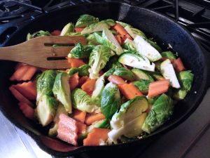 Fresh Brussels sprouts, sliced carrot, and ginger.