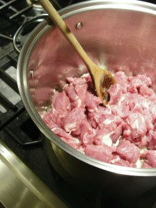 Begin with the cubed pork, over medium-low heat.